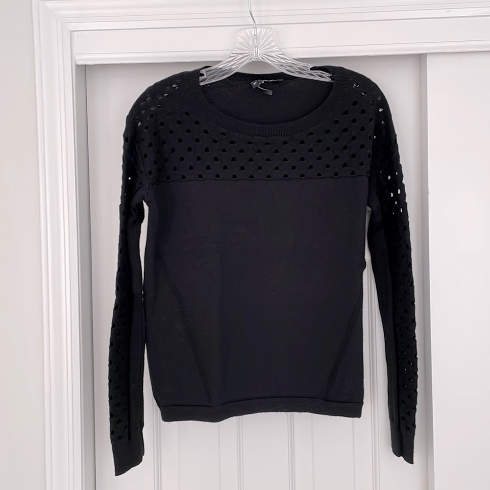 Merino wool sweater with open detail on yoke and sleeve.  Excellent condition
